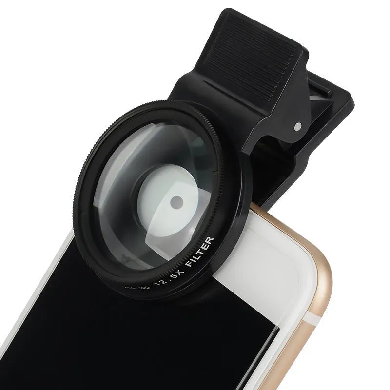 Smartphone macro close-up lens with aluminium frame and clip attachment on white background.