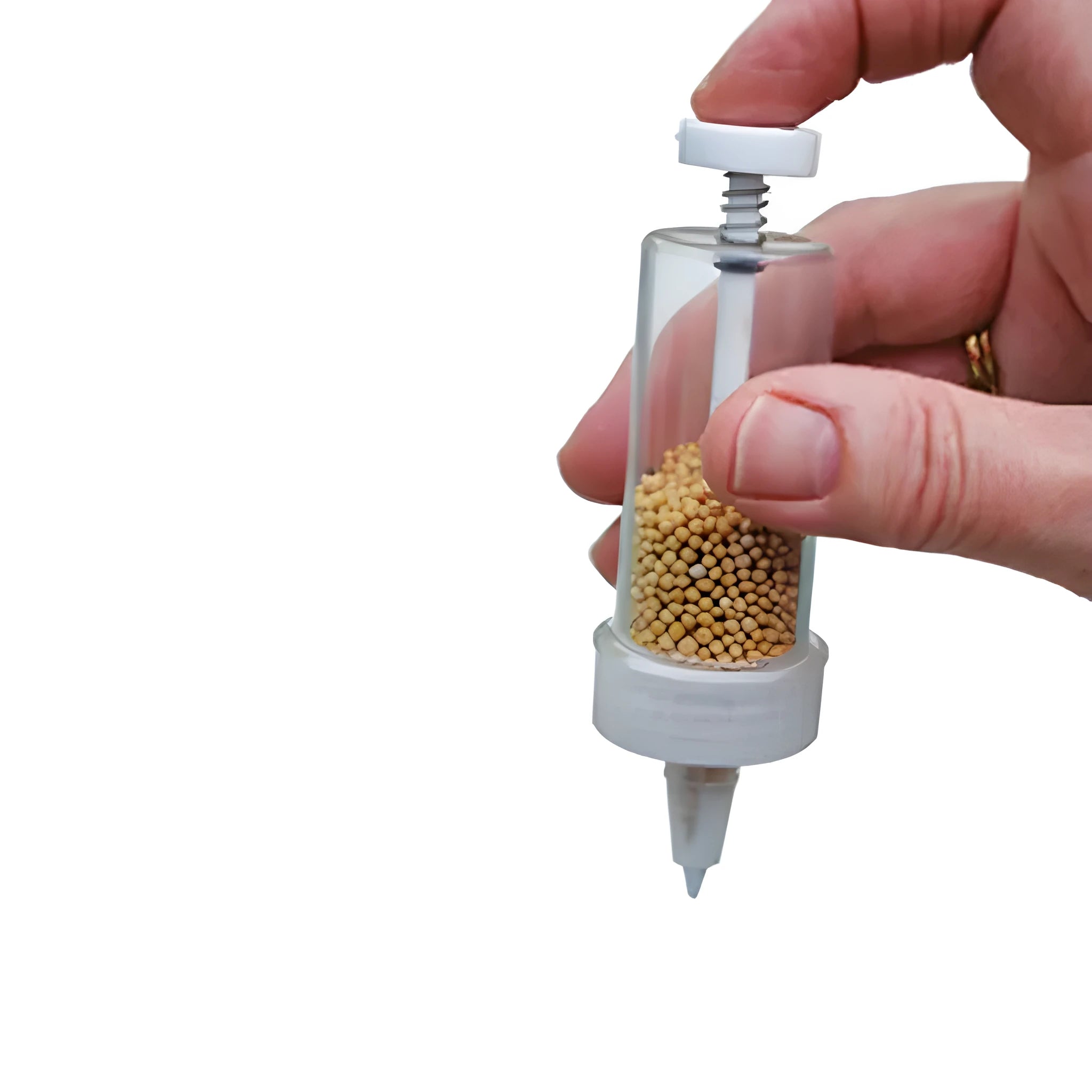A white plastic mini seeder tool measuring 12cm long, used for planting seeds in pots and trays.