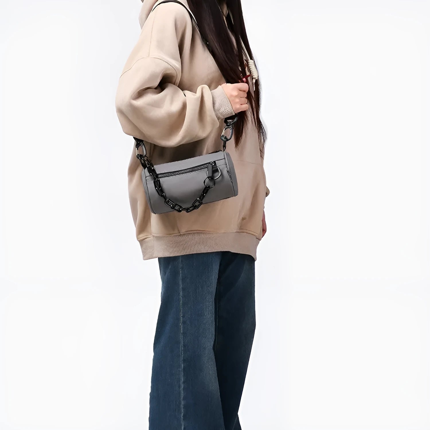 Black waterproof Oxford cloth messenger bag with a chain detail, shown as a crossbody bag.