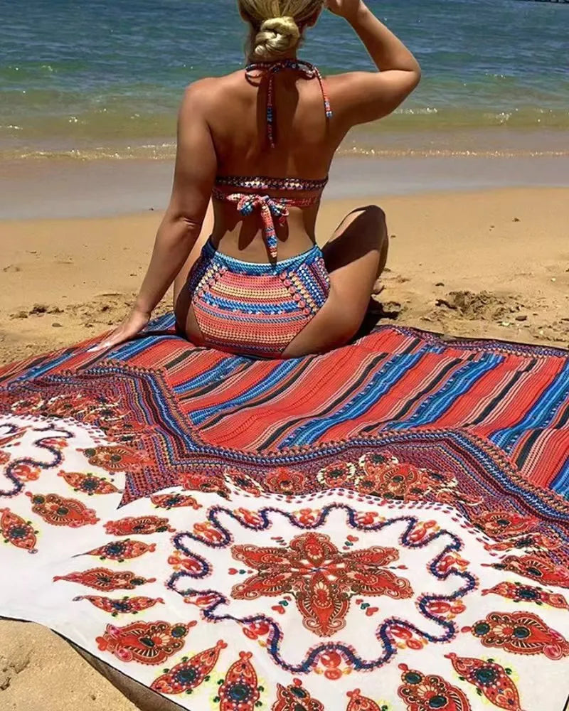 A three-piece women's swimsuit set showing a cutout blouse, high-waist briefs, and a sleeveless cover-up coat.