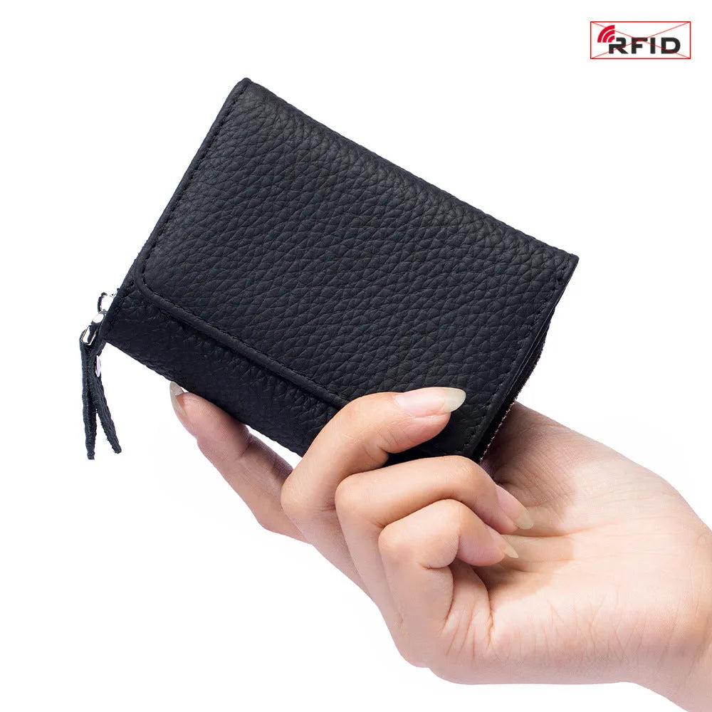 Women's leather tri-fold mini RFID wallet in elephant gray, 10x4x7.5cm, with sewing thread detailing