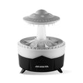 White UFO-shaped humidifier with water droplets creating mist and rain sounds