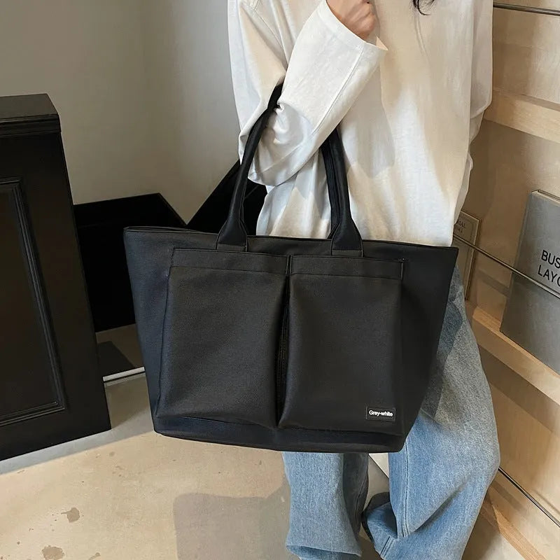 Sporty green PU shoulder bag with adjustable straps showing expandable compartments.
