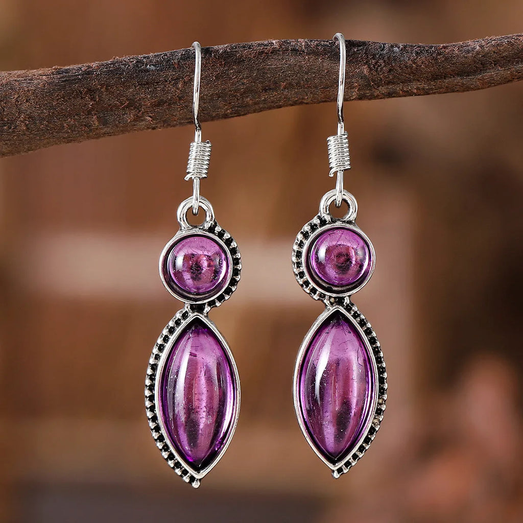 A pair of vintage geometric pendant earrings in black and purple with a round detail, made from zinc alloy.