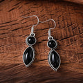 A pair of vintage geometric pendant earrings in black and purple with a round detail, made from zinc alloy.