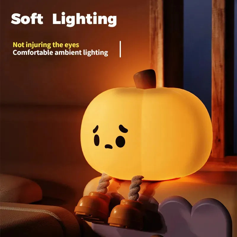 Orange pumpkin silicone night light with soft glowing illumination and touch controls