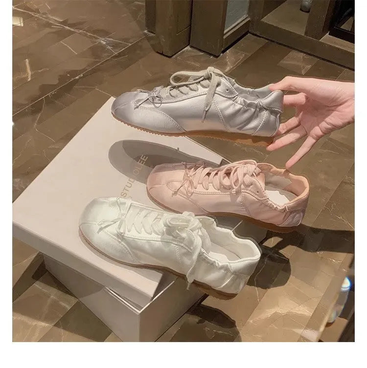 Women's satin ballet flats with round toe and lace-up closure in silver grey, pearl white and champagne pink colours