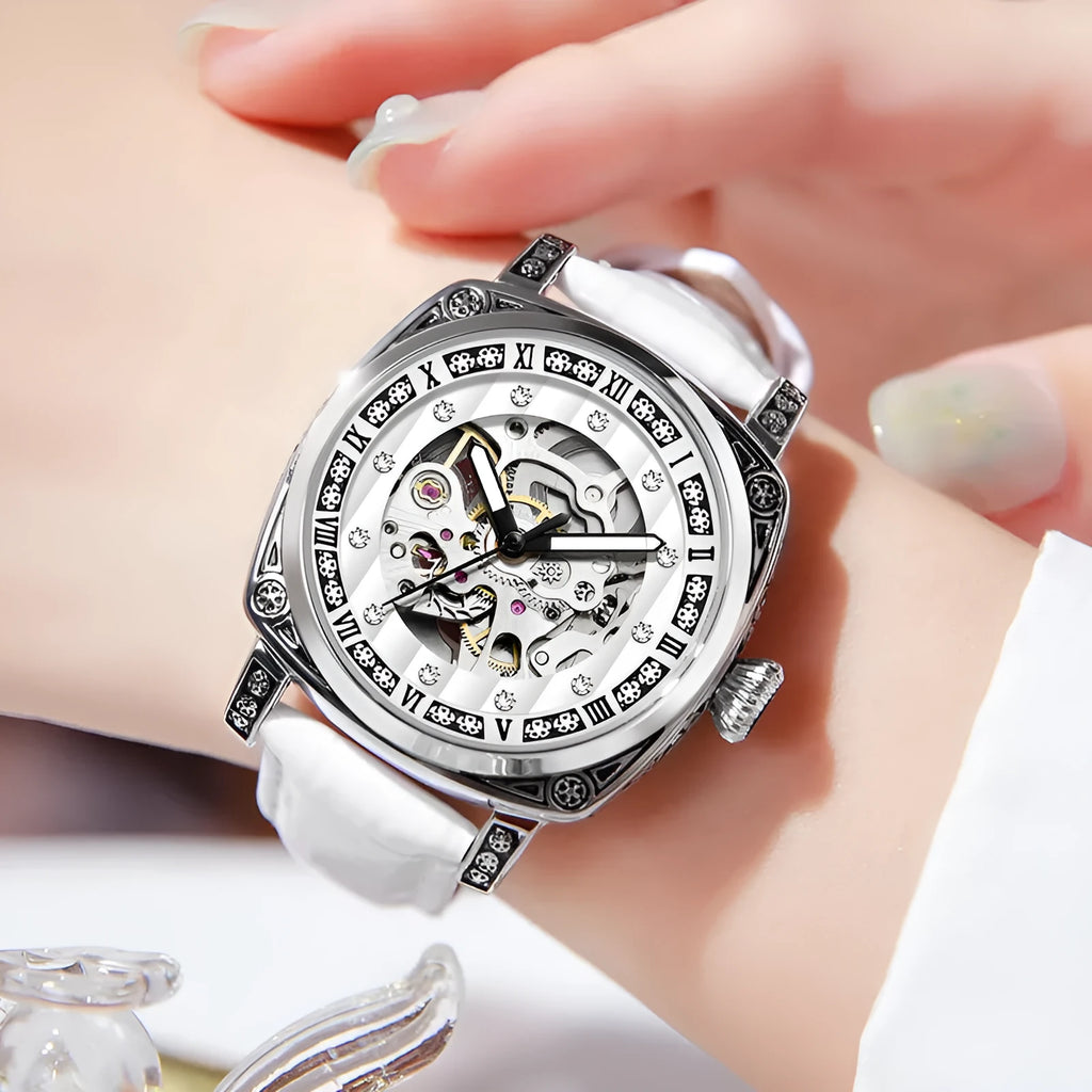 Mechanical watch with leather strap and luminous hands on a dial, shown in multiple colour options.