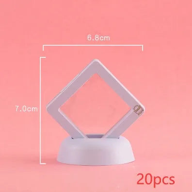 3D floating display case holding coins and jewellery between transparent membrane sheets