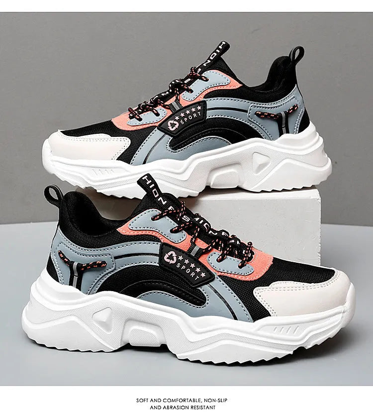 Women's thick-soled casual sports shoes with mesh upper and buckle detailing in black colour