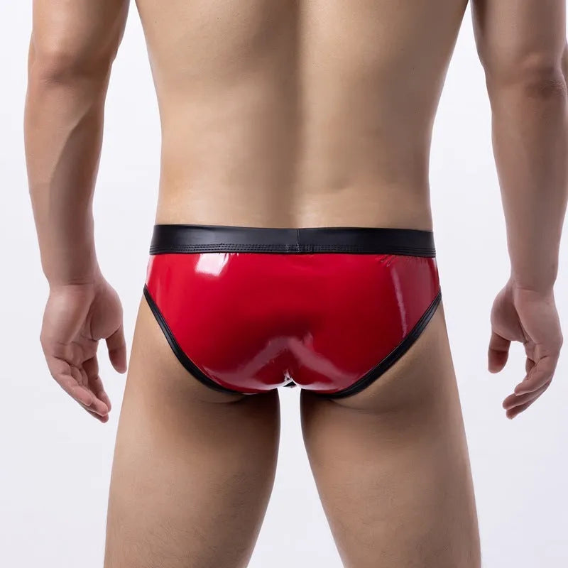 Men's gold patent leather polyester bikini swim briefs on a plain background