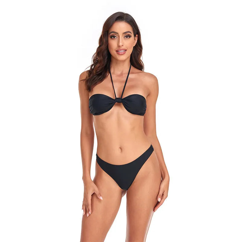 Black women's bikini set with lace-up tube top and briefs on a white background.