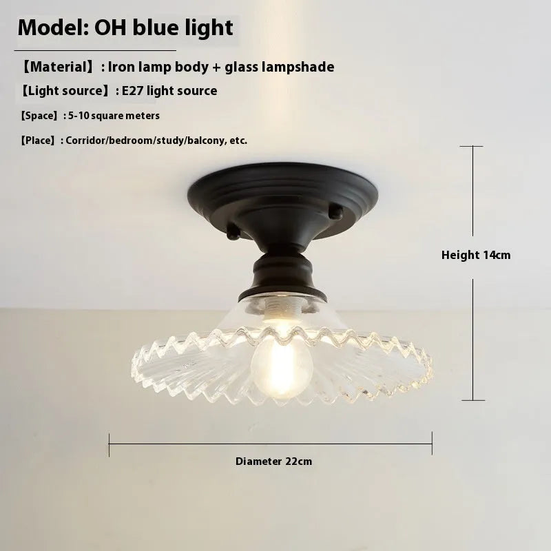 American retro style single-head ceiling or wall lamp with a glass cover.