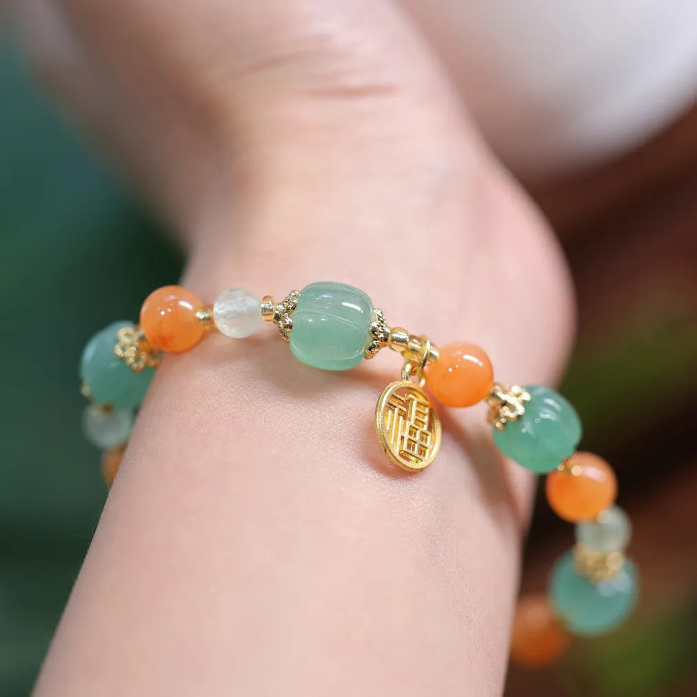 Women's Chinese style Duobao pumpkin bracelet made of Jinsi Jade and Prehnite beads.