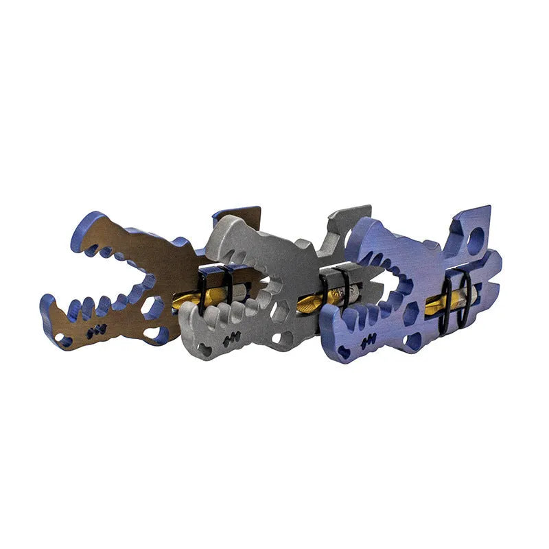 Grey TC4 titanium dinosaur head survival tool 78x42x5mm on a grey background