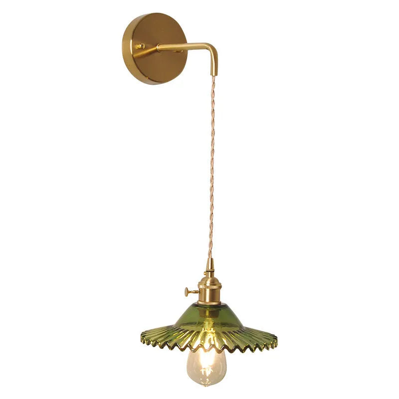 Retro copper wall lamp with a glass shade in a choice of six colours on a wall.