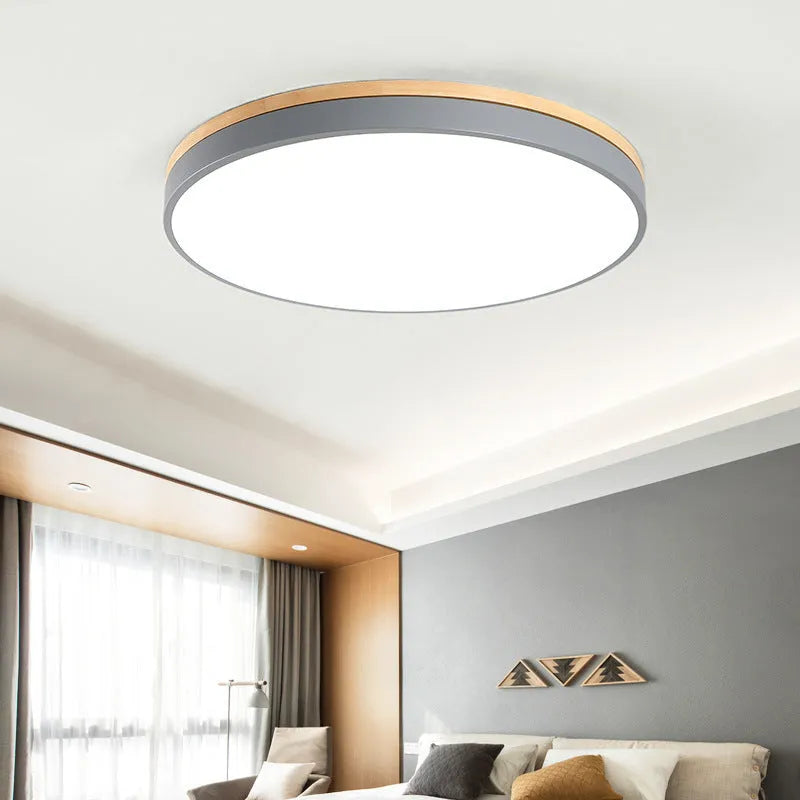 Round solid wood LED ceiling lamp with Nordic design in white finish showing dimmable light feature