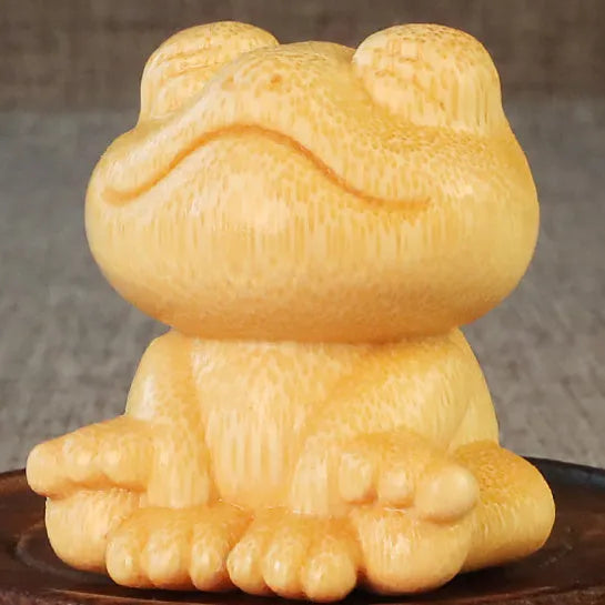 Smiling frog solid bamboo carving ornament with cartoon style measuring 5cm tall