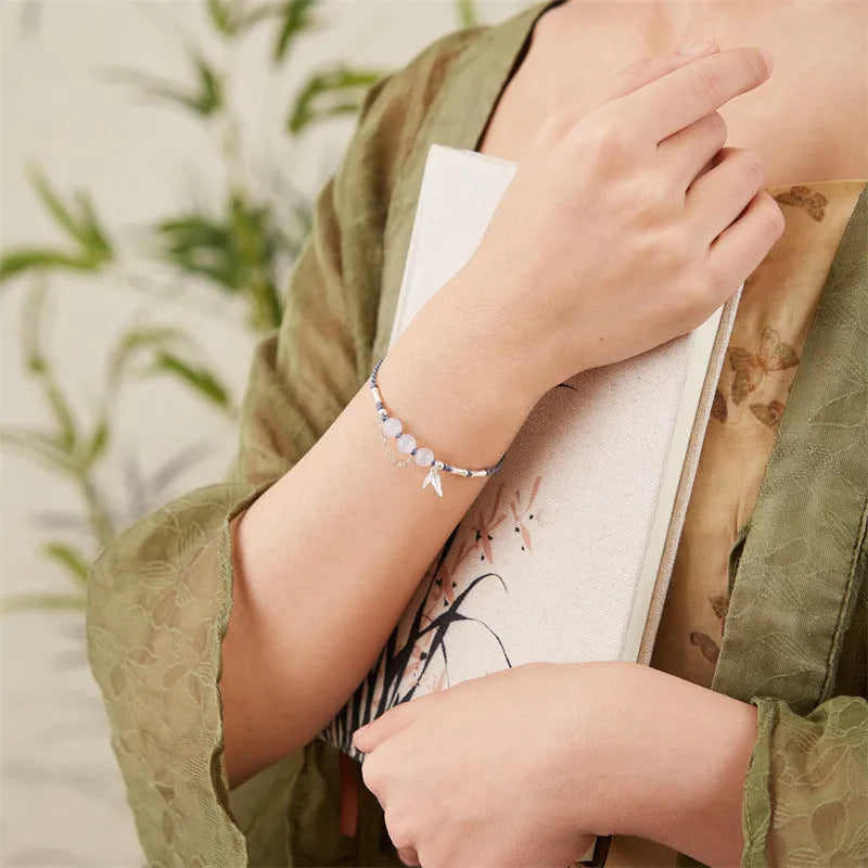 Women's handmade Hetian jade bracelet with woven chalcedony beads and lotus seedpod diamond pattern