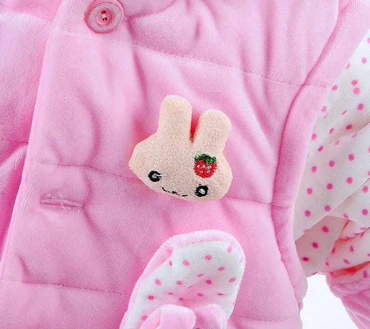 Girls' pink autumn winter three-piece clothing set with jacket, vest, and long trousers on a hanger.