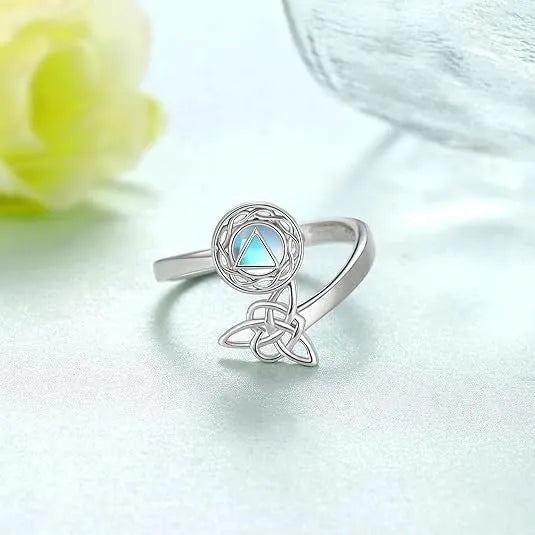 Rotating moonstone ring bracelet in white gold colour with adjustable opening and geometric circle and triangle design