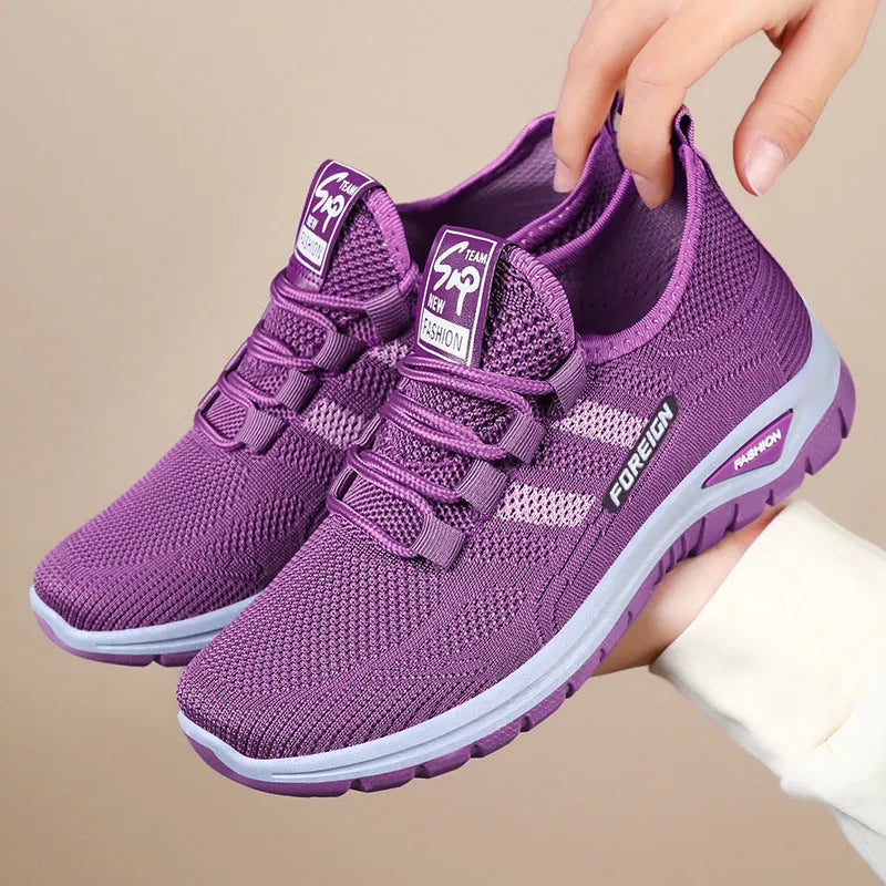 Breathable mesh casual shoes in black, grey, purple, and red colours with flat PVC sole