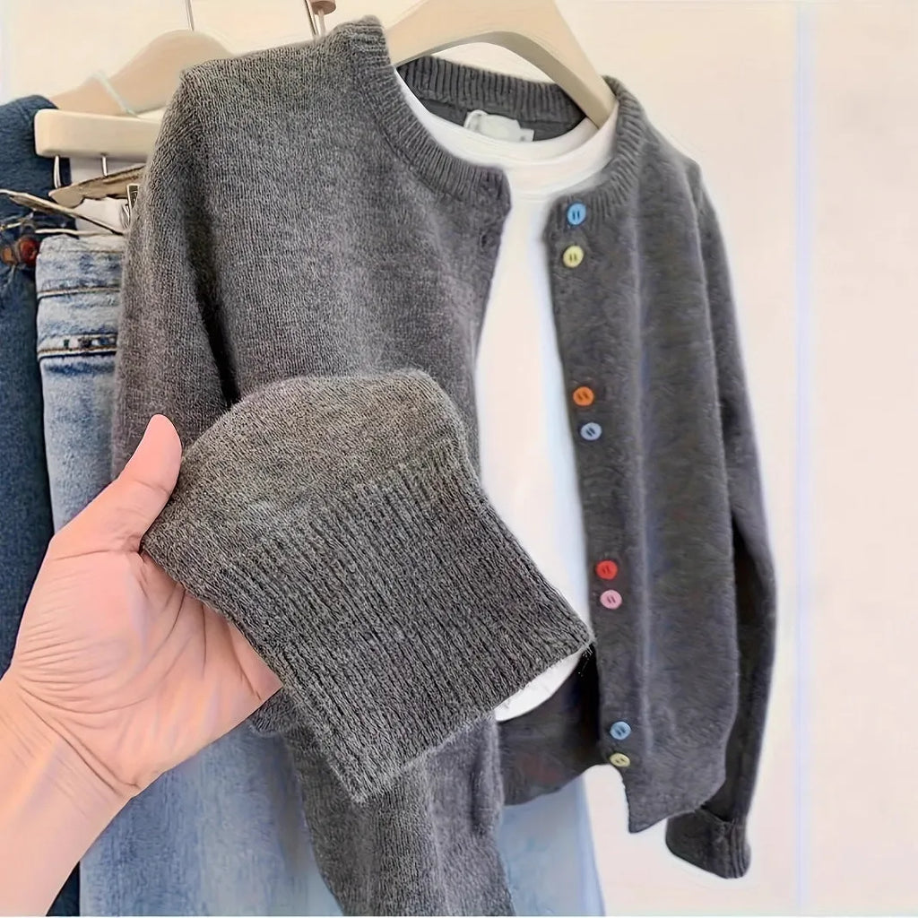 Dark grey women's button-up cardigan sweater with long sleeves on a hanger.