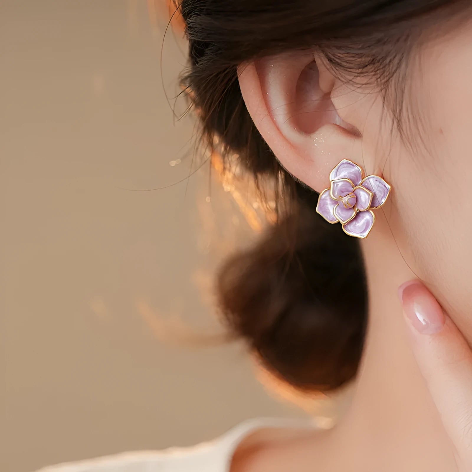 Gold plated purple oil-spot glaze flower stud earrings on a copper base.
