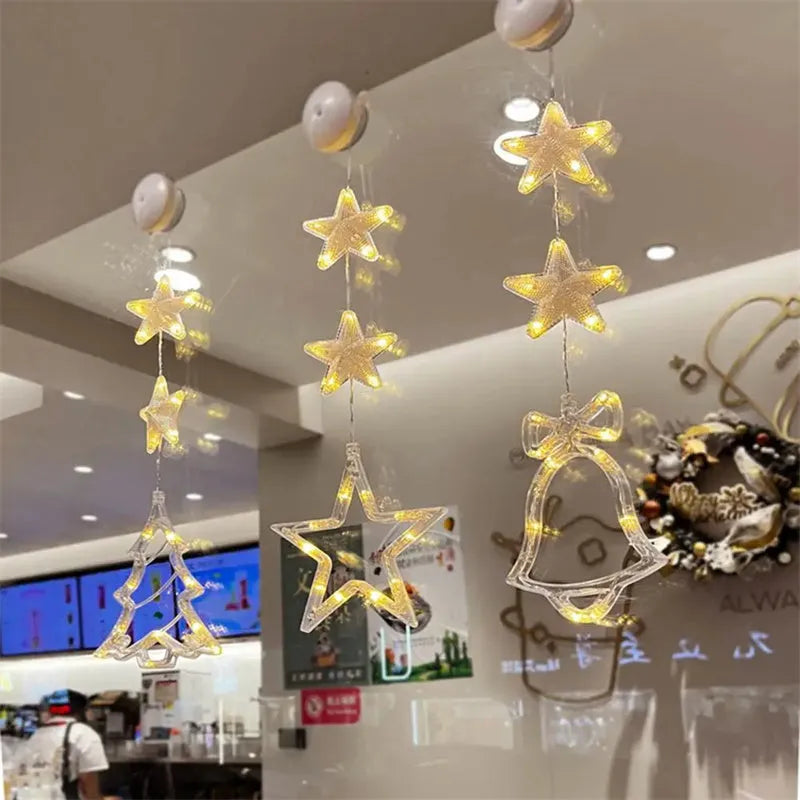 Christmas LED window light with suction cups showing deer, bell, and tree designs