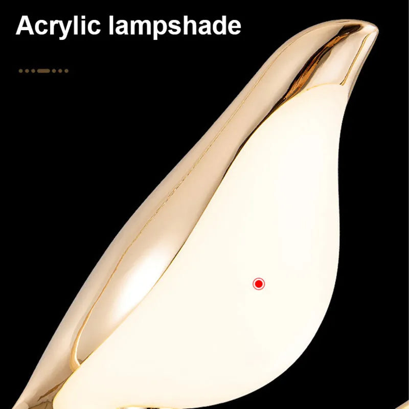 Modern minimalist magpie bird silhouette chandelier light fitting with a long drop.