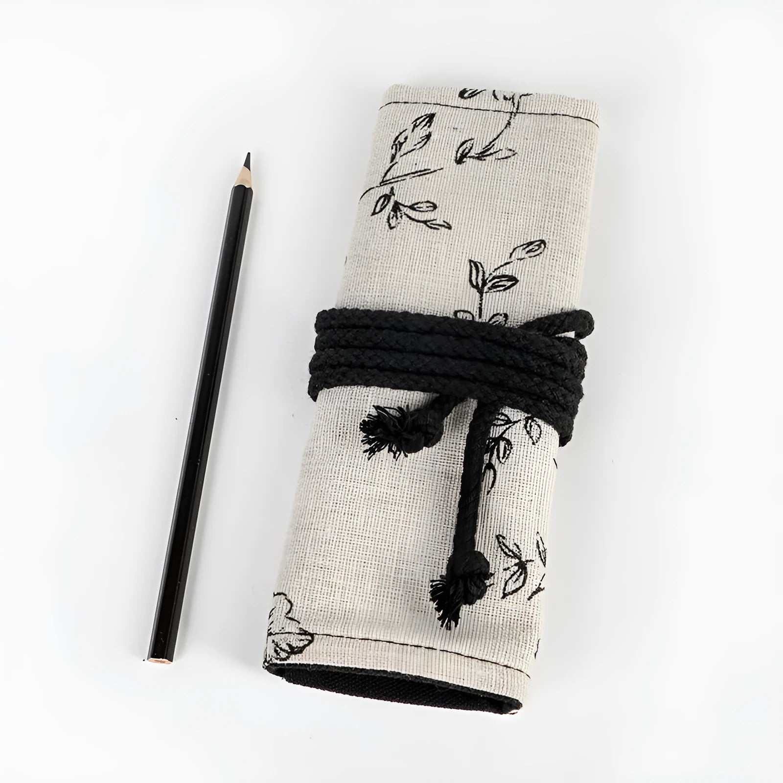 Black Peony printed canvas pencil roll bag open to show 24 or 72 holes for pencils on cotton hemp fabric.