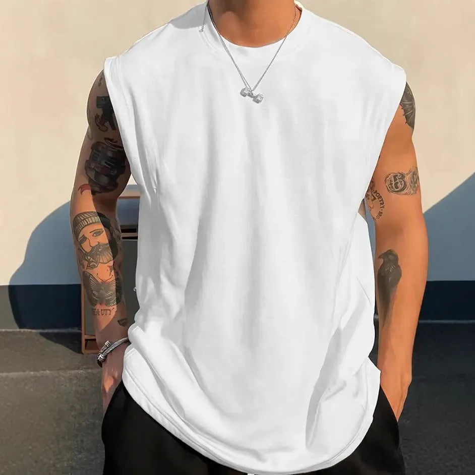 Men's loose cotton tank top in solid colours showing straight hem design and sleeveless cut