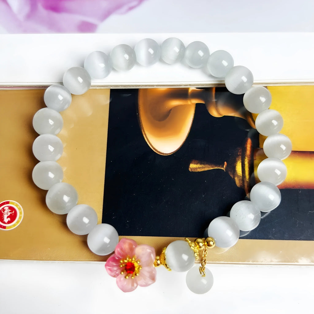 White opal flower beaded bracelet with colourful glaze accents on glass beads.