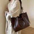 Retro easy matching shoulder commuter tote bag in PU with fold details, black colour, medium hardness