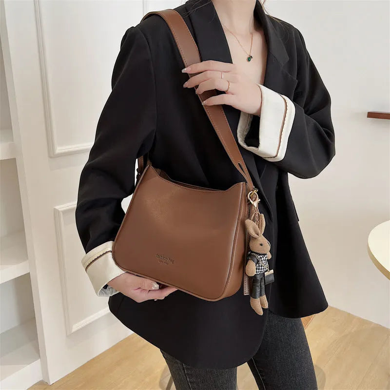 PU shoulder messenger bag in horizontal square shape with slit pocket available in black colour
