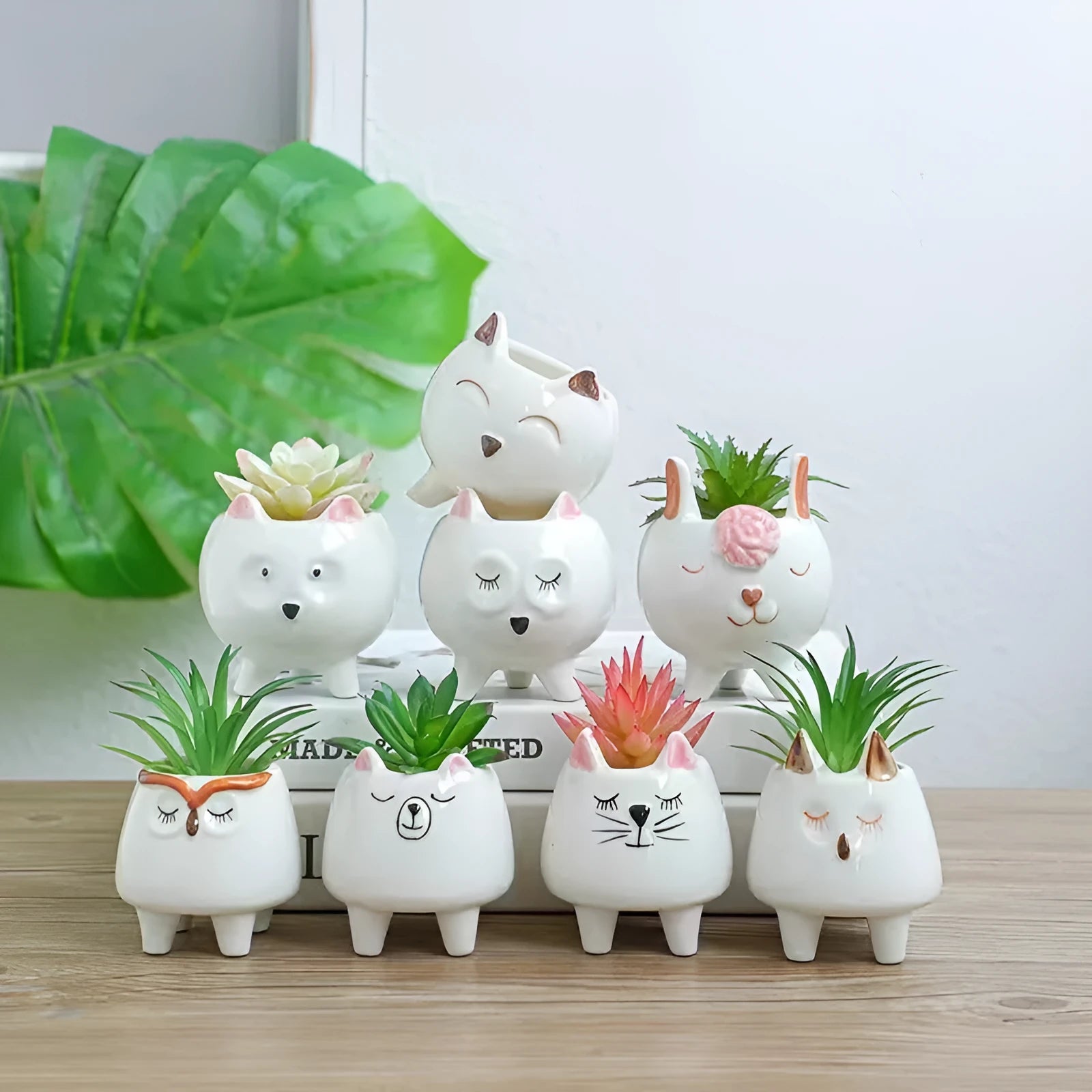 Ceramic succulent flowerpot with hand-painted cartoon animal and floral design in a pastoral style.