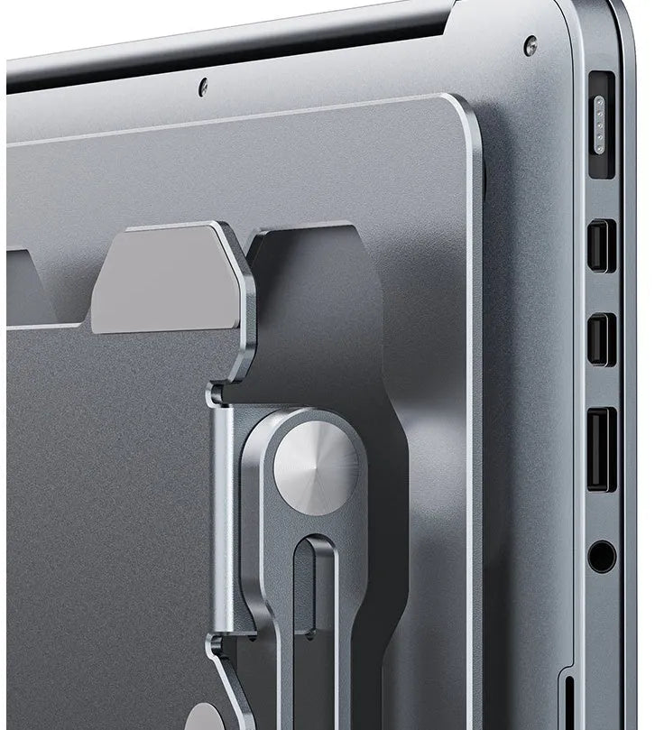 Grey adjustable aluminum laptop stand in folded and open positions on a wooden desk