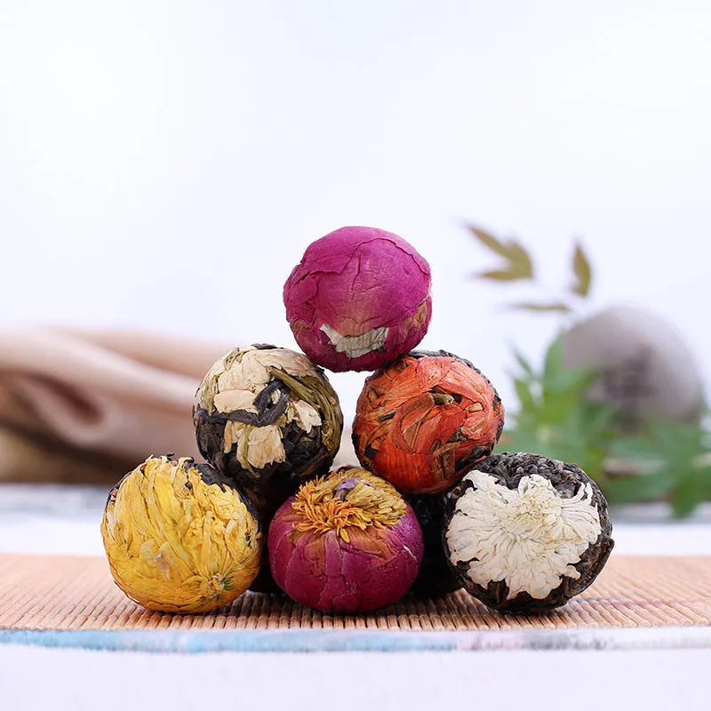 Six flavour flower tea gift box with 18 tablets featuring jasmine, lily, peony, yellow chrysanthemum, rose, and chrysanthemum