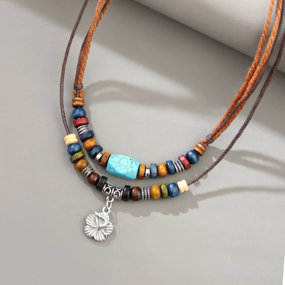 Turquoise wooden bead necklace for men with alloy geometric flower pendant on wax rope chain
