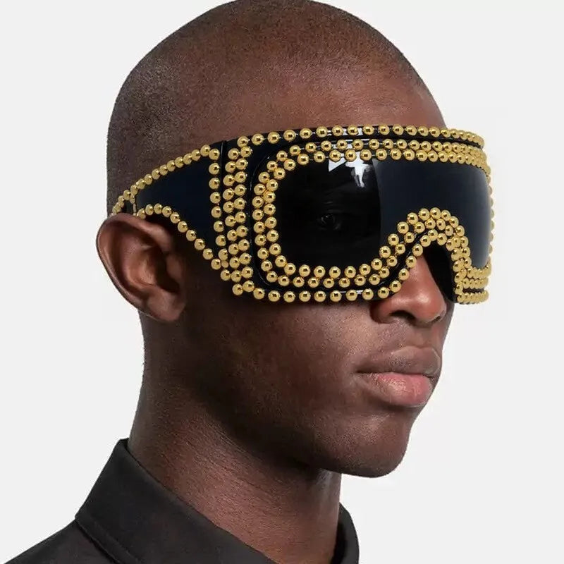 Men's punk style sunglasses with a large square frame and silver rivet details