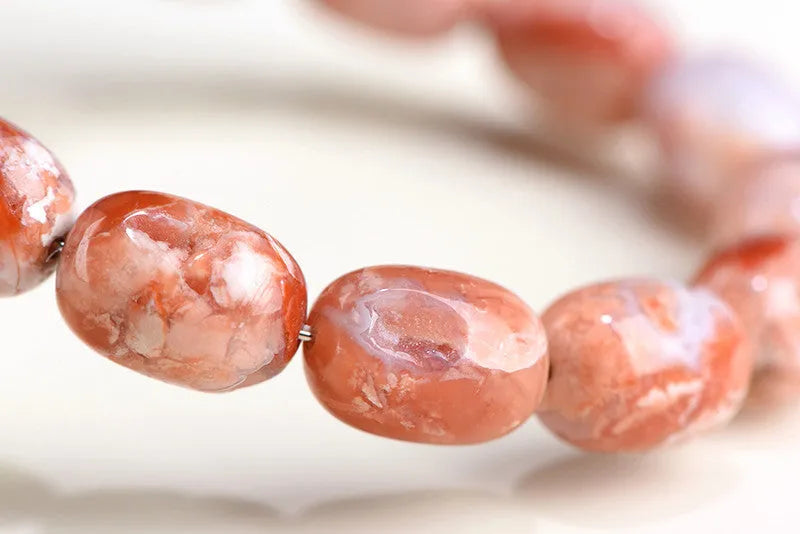 Natural cherry agate barrel shaped bead bracelet with 10x14mm geometry beads and Ruyi design elements