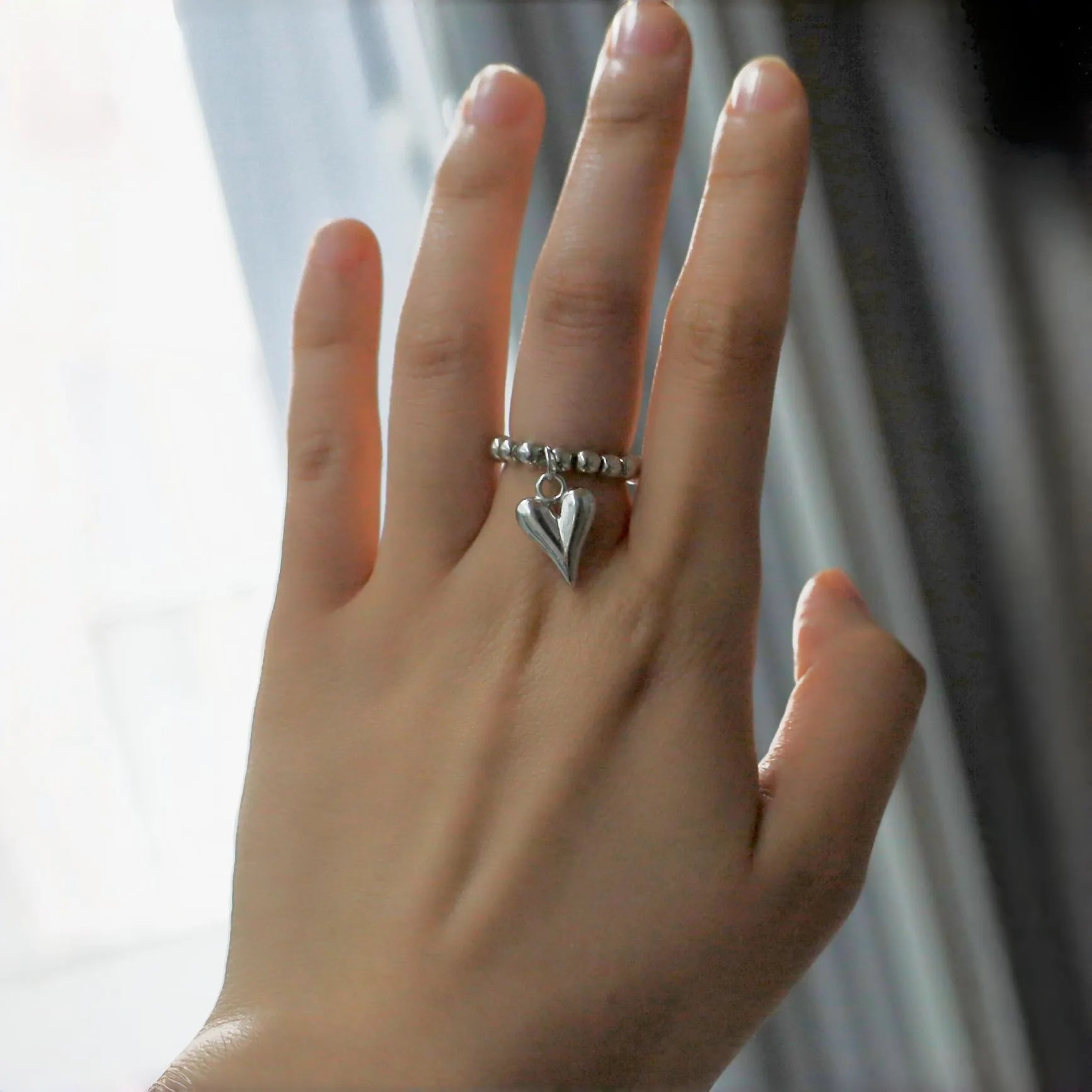 Handmade elastic beaded ring with love heart design in gold or white colour