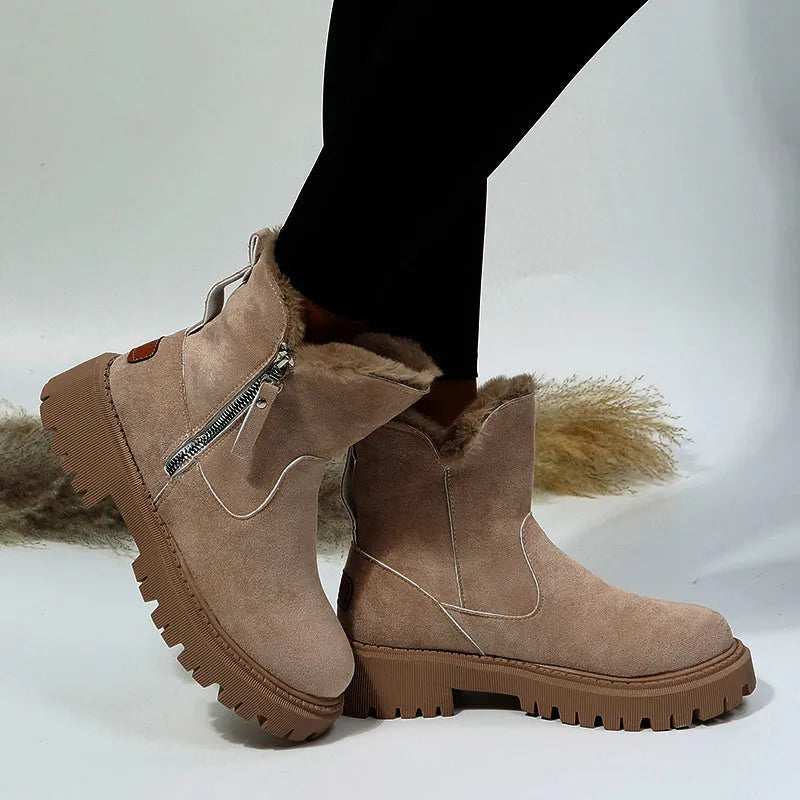 Women's black faux suede high-top snow boots with side zip and thick faux fur lining visible at the ankle.