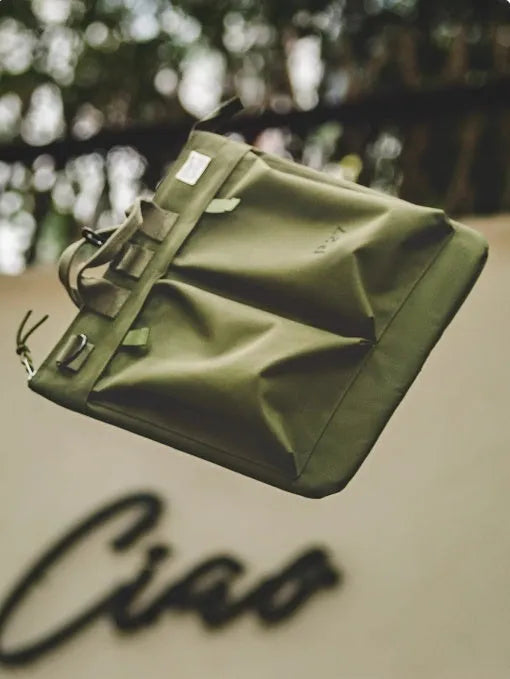 Canvas crossbody messenger bag in retro style with shoulder strap, showing internal phone pocket and 15-inch laptop capacity