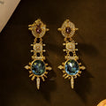 Gold geometric round stud earrings with diamond treatment surface detail