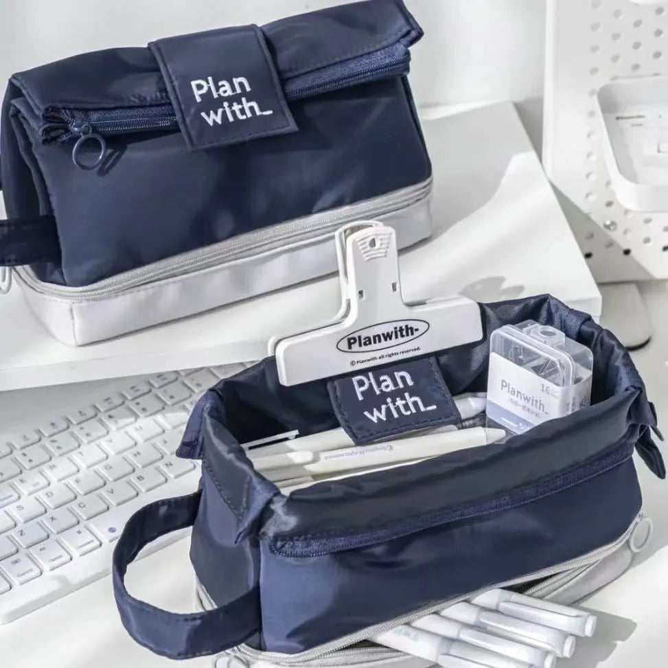 Double layer folding pencil case in polyester fabric showing navy blue, blue, and cream white colour options.