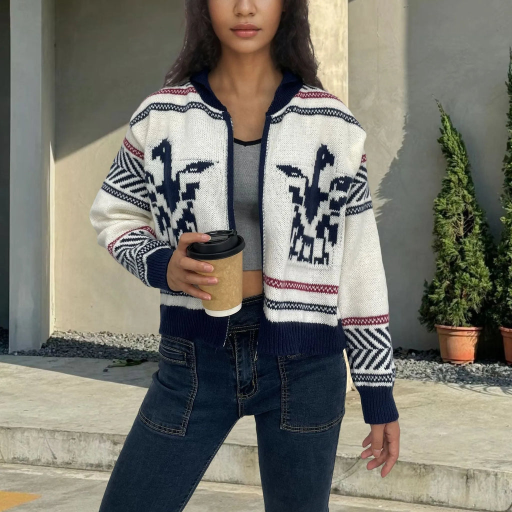 White women's zip-front cardigan with lapel collar and contrasting jacquard stripe pattern on sleeve.