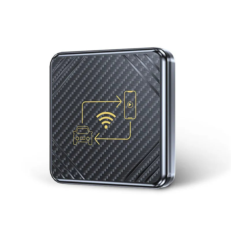 Gold and white wireless CarPlay and Android Auto USB adapter box for cars on a dark surface.