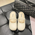 Women's black flip flop sandals with a toe cap design on a white background.