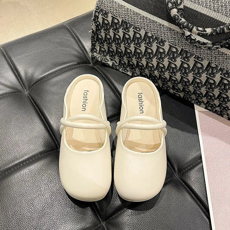 Women's black flip flop sandals with a toe cap design on a white background.